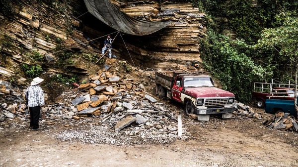 Men working a road-side quarry